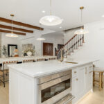 Kitchen and double islands with stained and painted cabinets