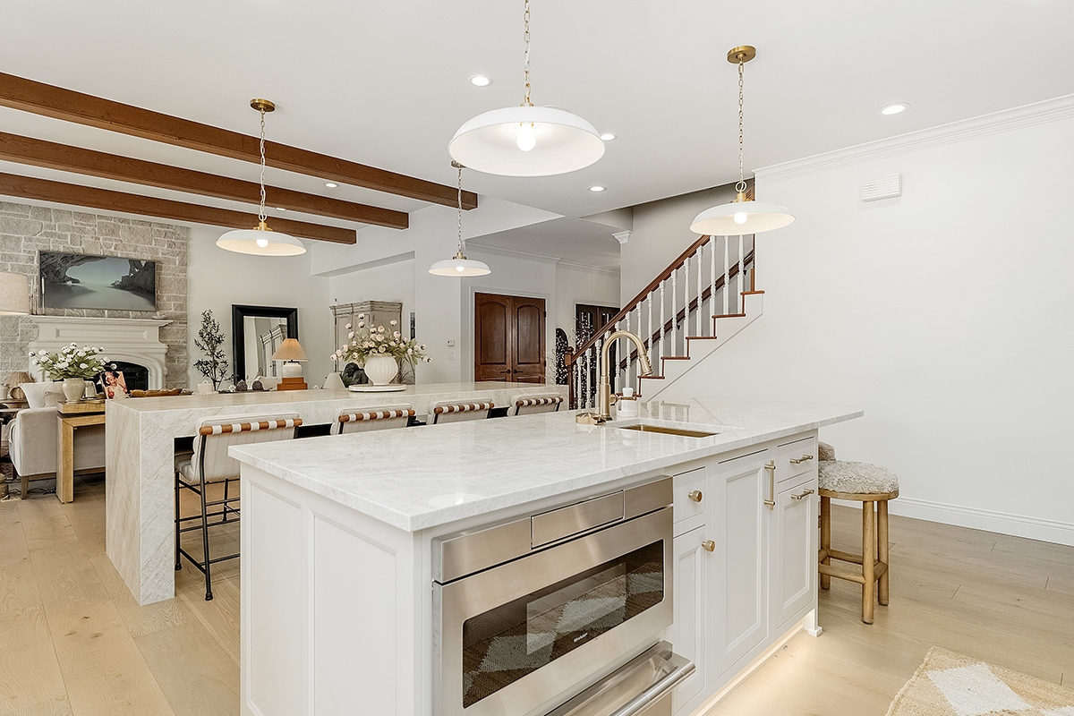 Kitchen and double islands with stained and painted cabinets