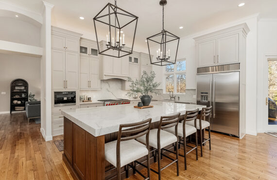 Painted kitchen cabinets with stained island
