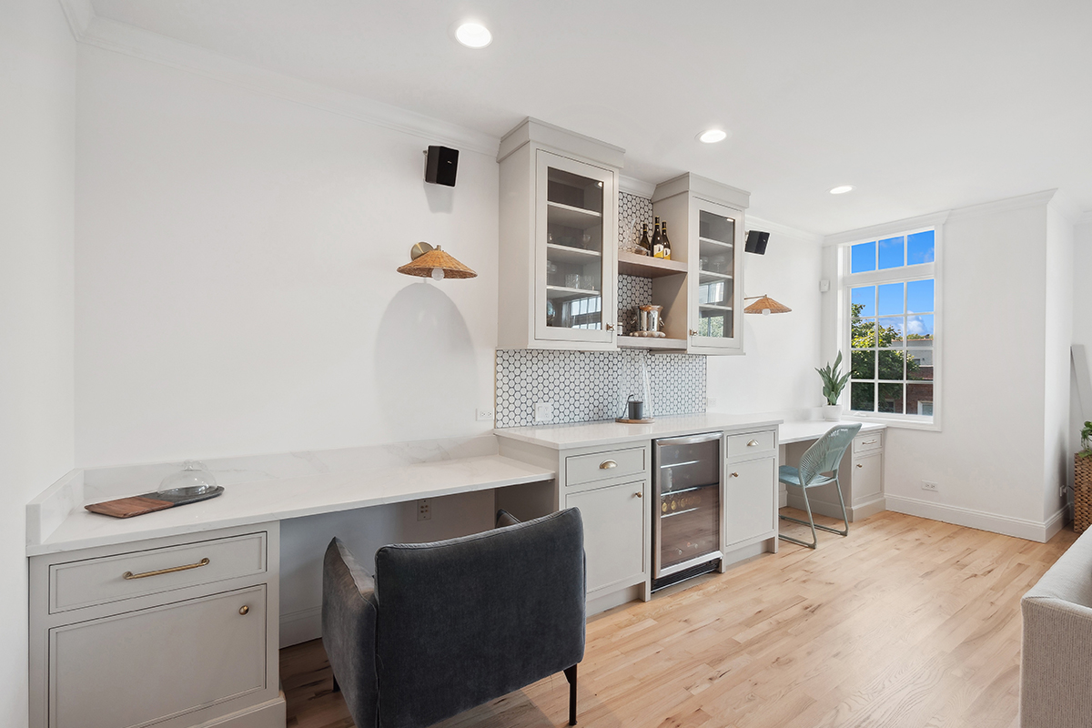 Desk and bar area with gray painted cabinets