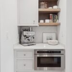 Painted coffee bar cabinets with a microwave