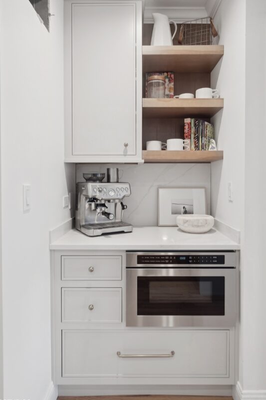 Painted coffee bar cabinets with a microwave