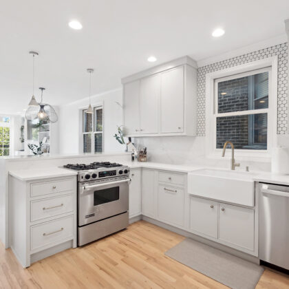 Painted kitchen cabinets including a stove and dishwasher