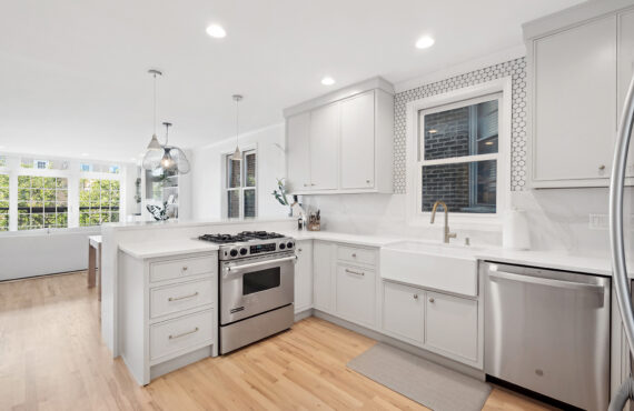 Painted kitchen cabinets including a stove and dishwasher
