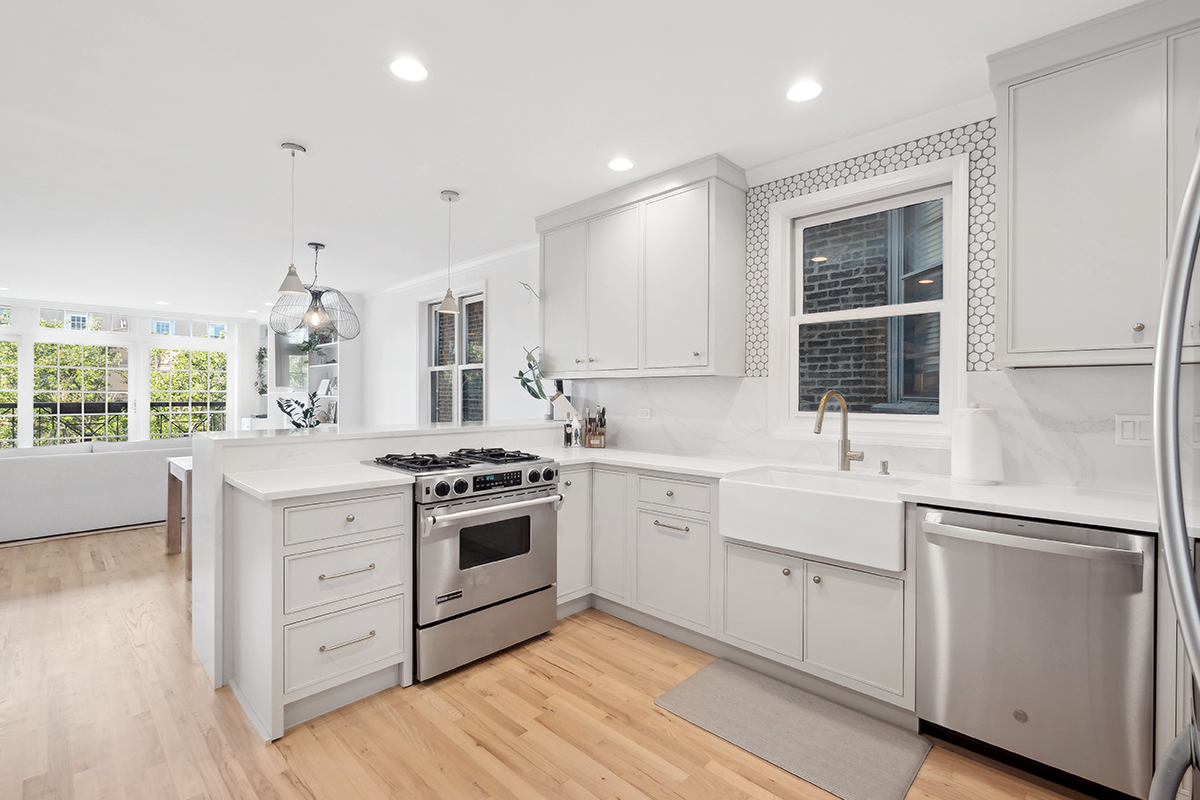 Painted kitchen cabinets including a stove and dishwasher
