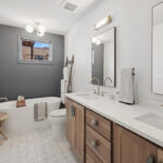 Stained bathroom vanity cabinet and tub