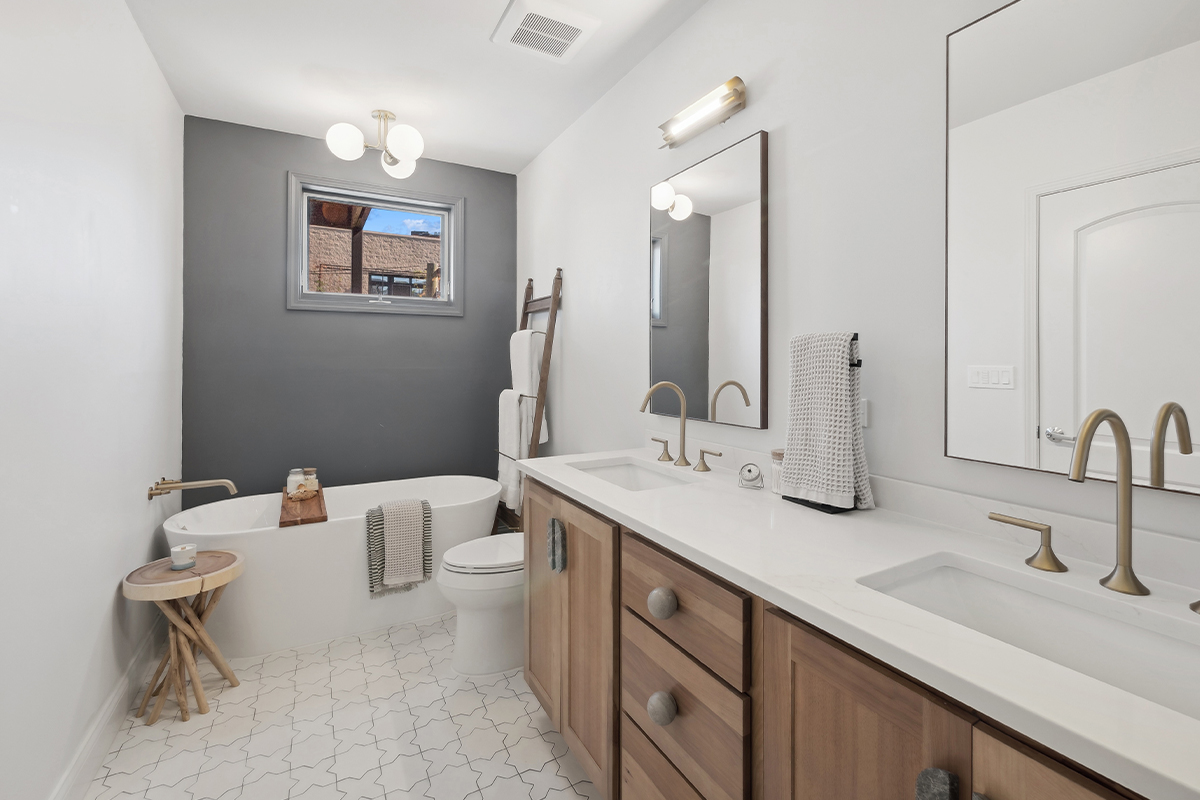 Stained bathroom vanity cabinet and tub