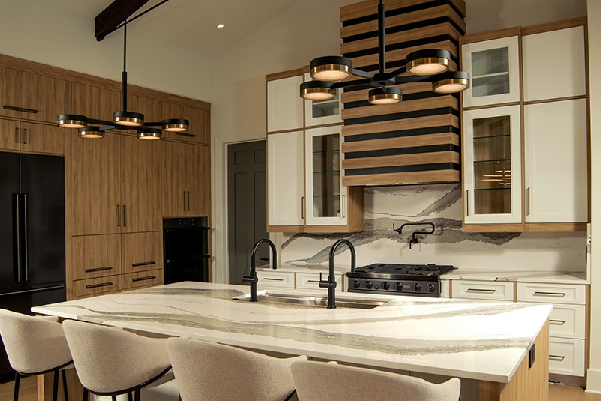 Contemporary and transitional kitchen and island with high ceilings and wood beams.