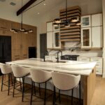 Contemporary and transitional kitchen and island with high ceilings and wood beams.