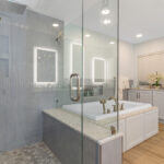 Painted master bath cabinets with glass wall shower