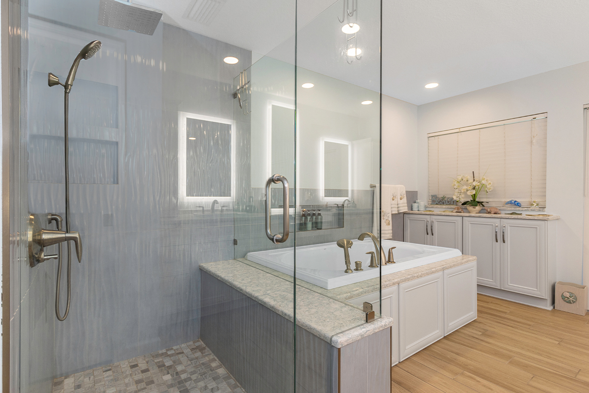Painted master bath cabinets with glass wall shower