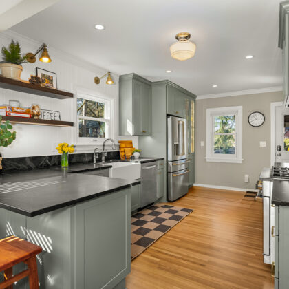 Kitchen with green cabinets and checkerboard floor