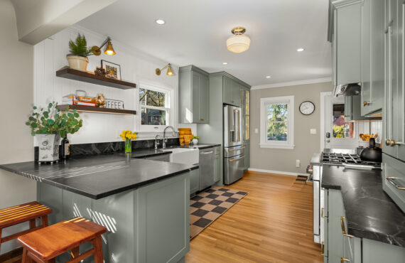 Kitchen with green cabinets and checkerboard floor