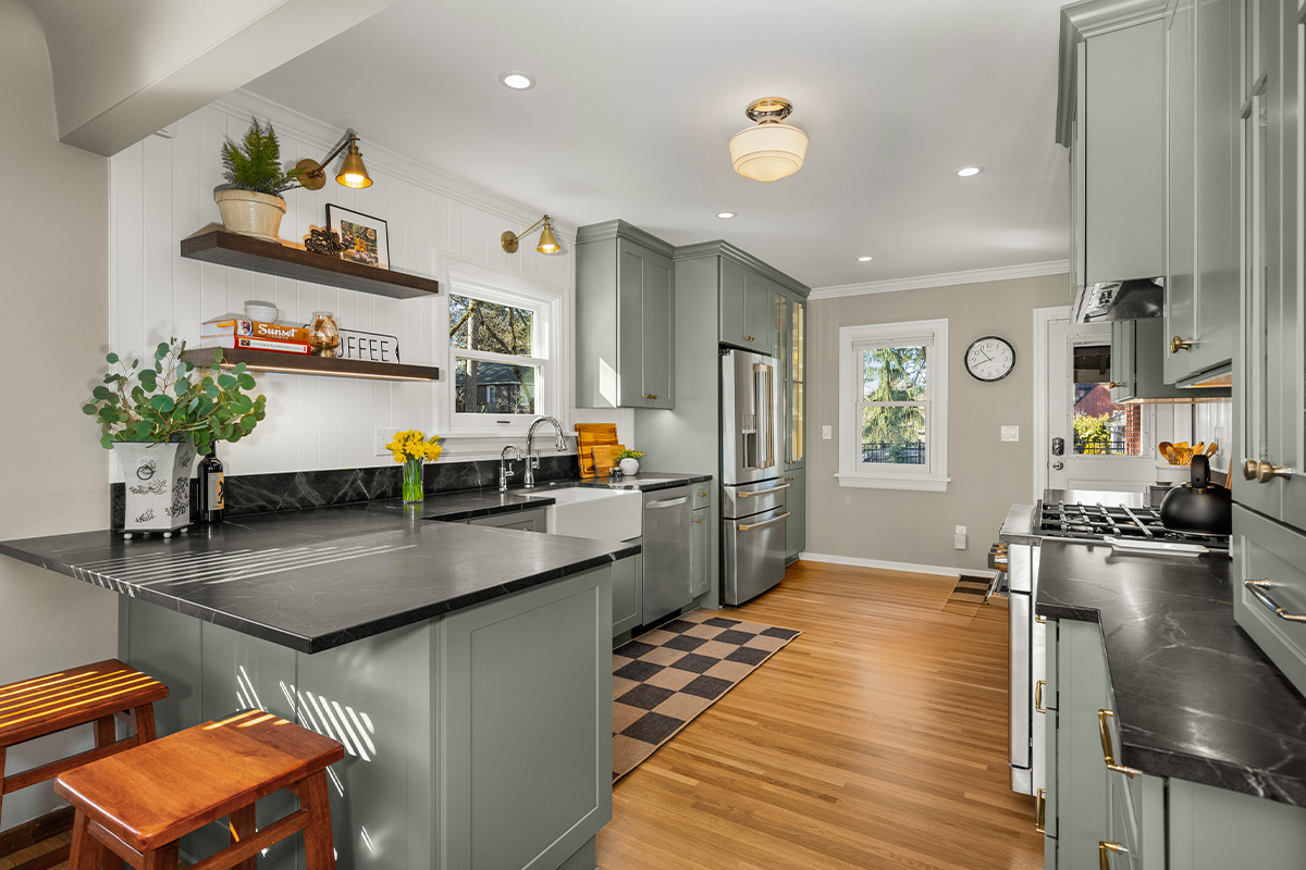 Kitchen with green cabinets and checkerboard floor