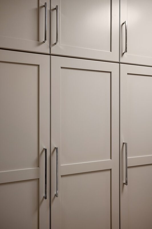 Light Mocha painted kitchen pantry cabinets.