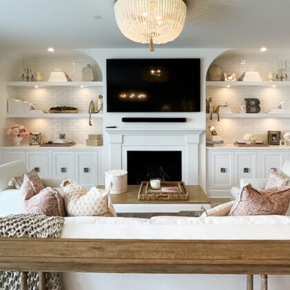 Entertainment Center in painted white cabinets and fireplace surround