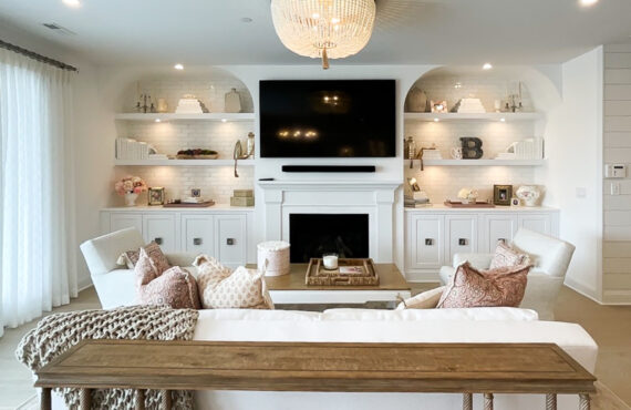 Entertainment Center in painted white cabinets and fireplace surround