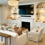 Entertainment Center in painted white cabinets and fireplace surround