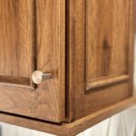 Stained kitchen cabinet. Photo shows detail of the applied molding Savannah door style