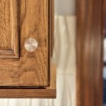 Stained kitchen cabinet. Photo shows detail of the applied molding Savannah door style
