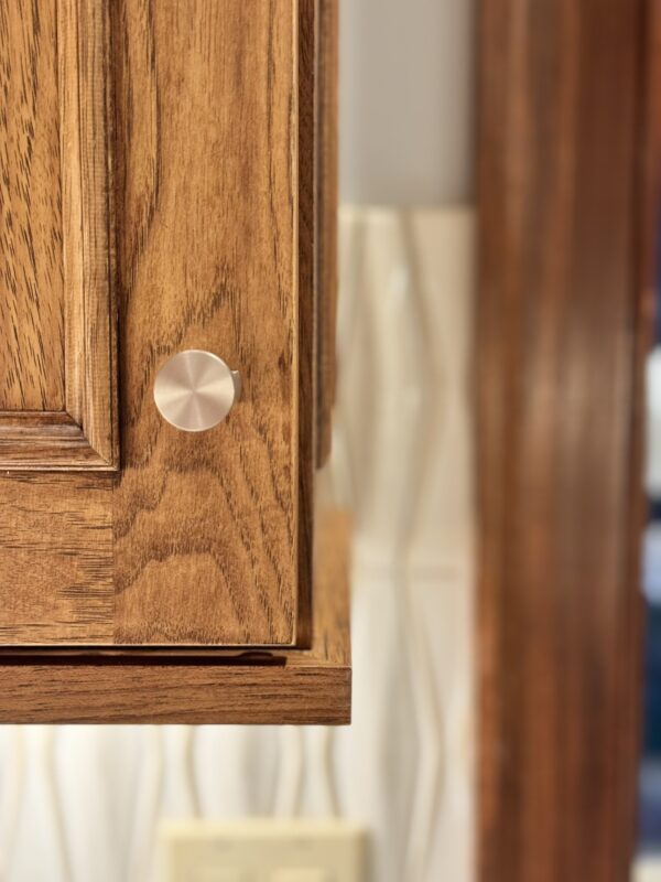 Stained kitchen cabinet. Photo shows detail of the applied molding Savannah door style