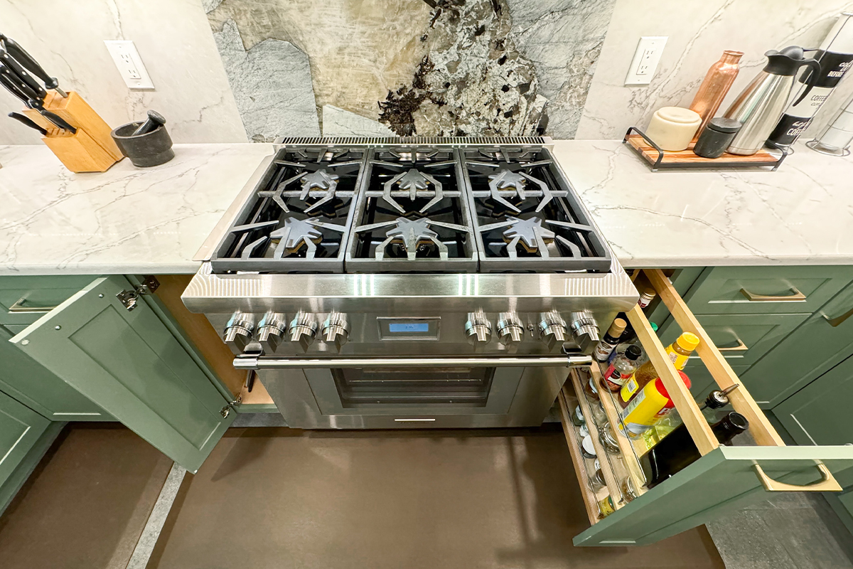 Stove with green painted cabinets