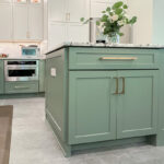 Painted kitchen cabinets in green bases and white wall cabinets