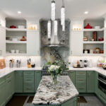 Painted kitchen cabinets in green bases and white wall cabinets