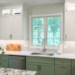 Painted kitchen cabinets in green bases and white wall cabinets