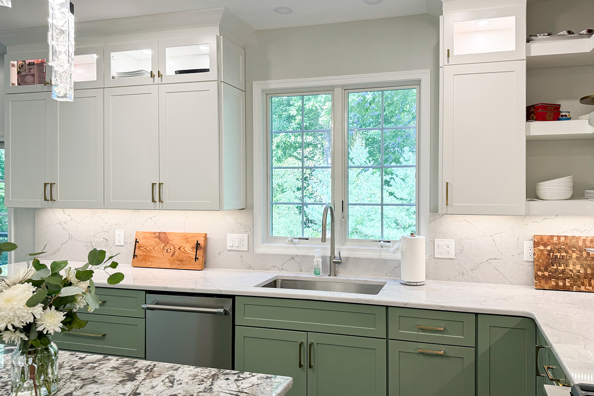 Painted kitchen cabinets in green bases and white wall cabinets