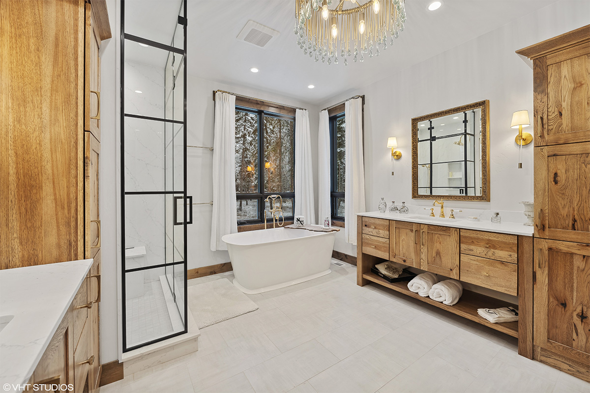 Rustic Hickory bathroom vanity with standalone tub and shower with glass walls