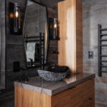Contemporary bathroom with stained slab door vanity