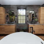 Contemporary bathroom with standalone tub and a wall of vines