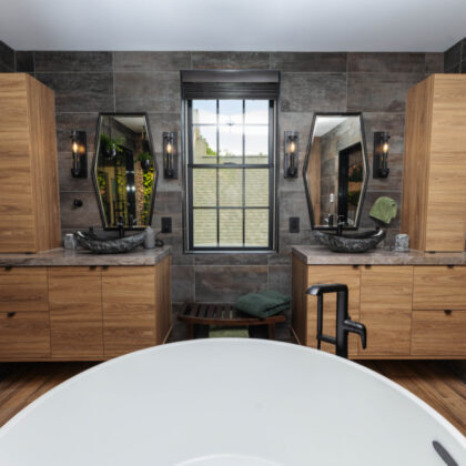 Contemporary bathroom with standalone tub and a wall of vines