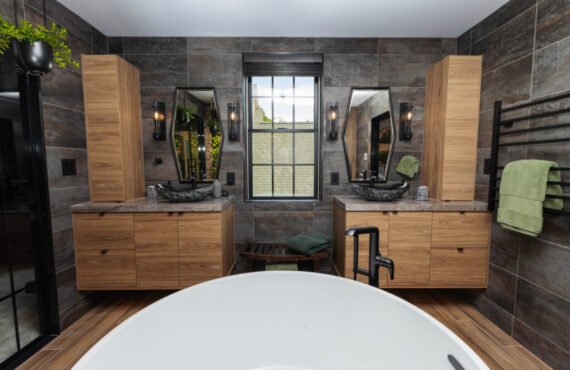 Contemporary bathroom with standalone tub and a wall of vines