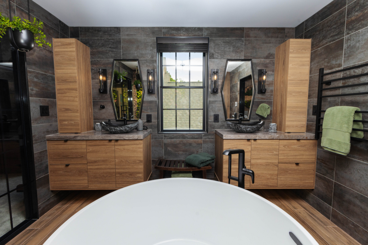 Contemporary bathroom with standalone tub and a wall of vines