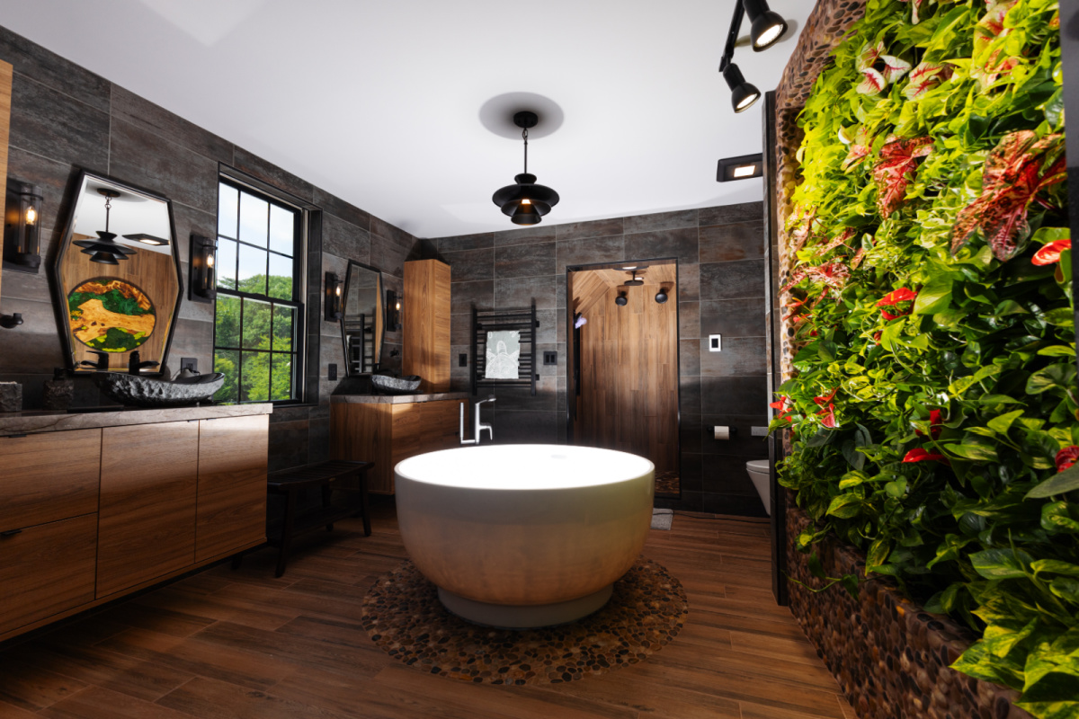 Contemporary bathroom with standalone tub and a wall of vines