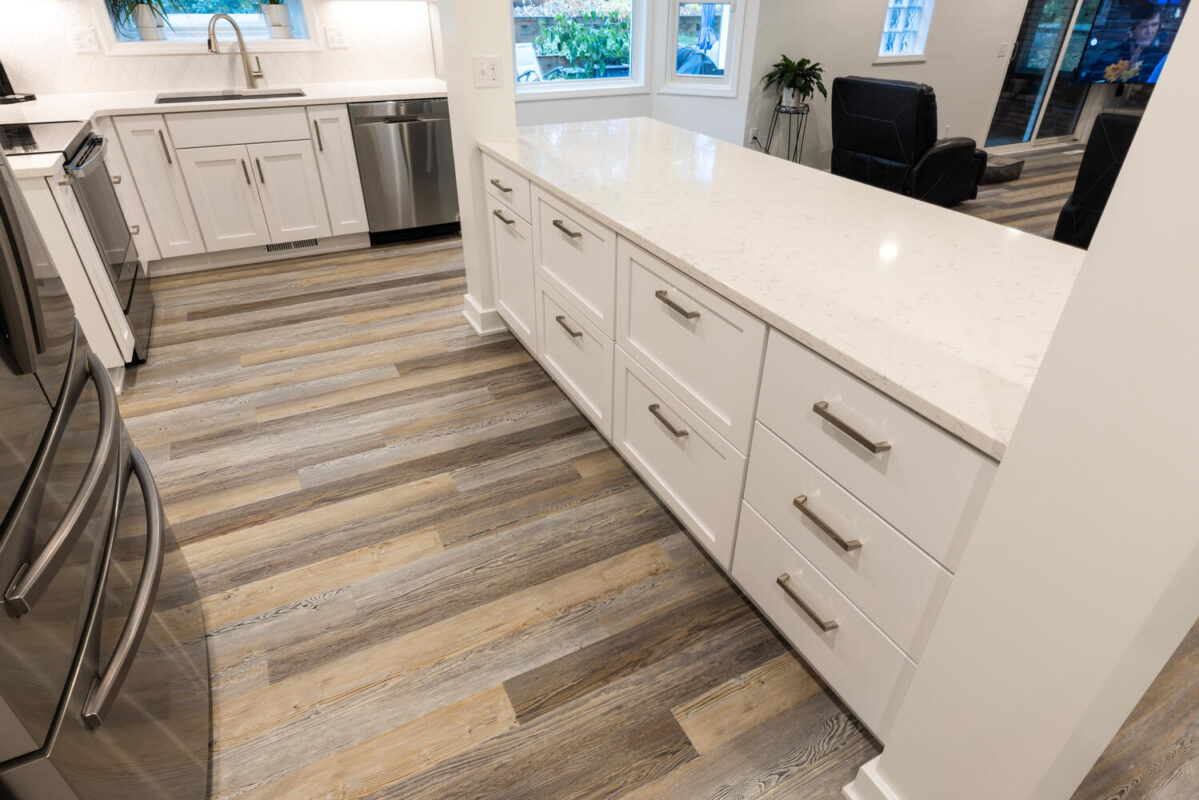 kitchen with white painted perimeter cabinets