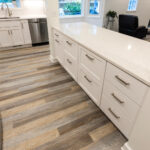 kitchen with white painted perimeter cabinets