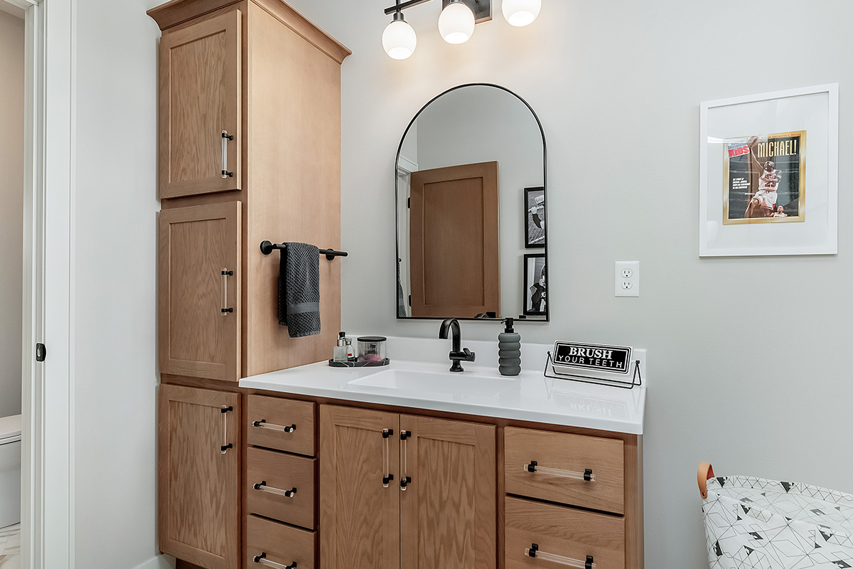Stained single sink bathroom vanity
