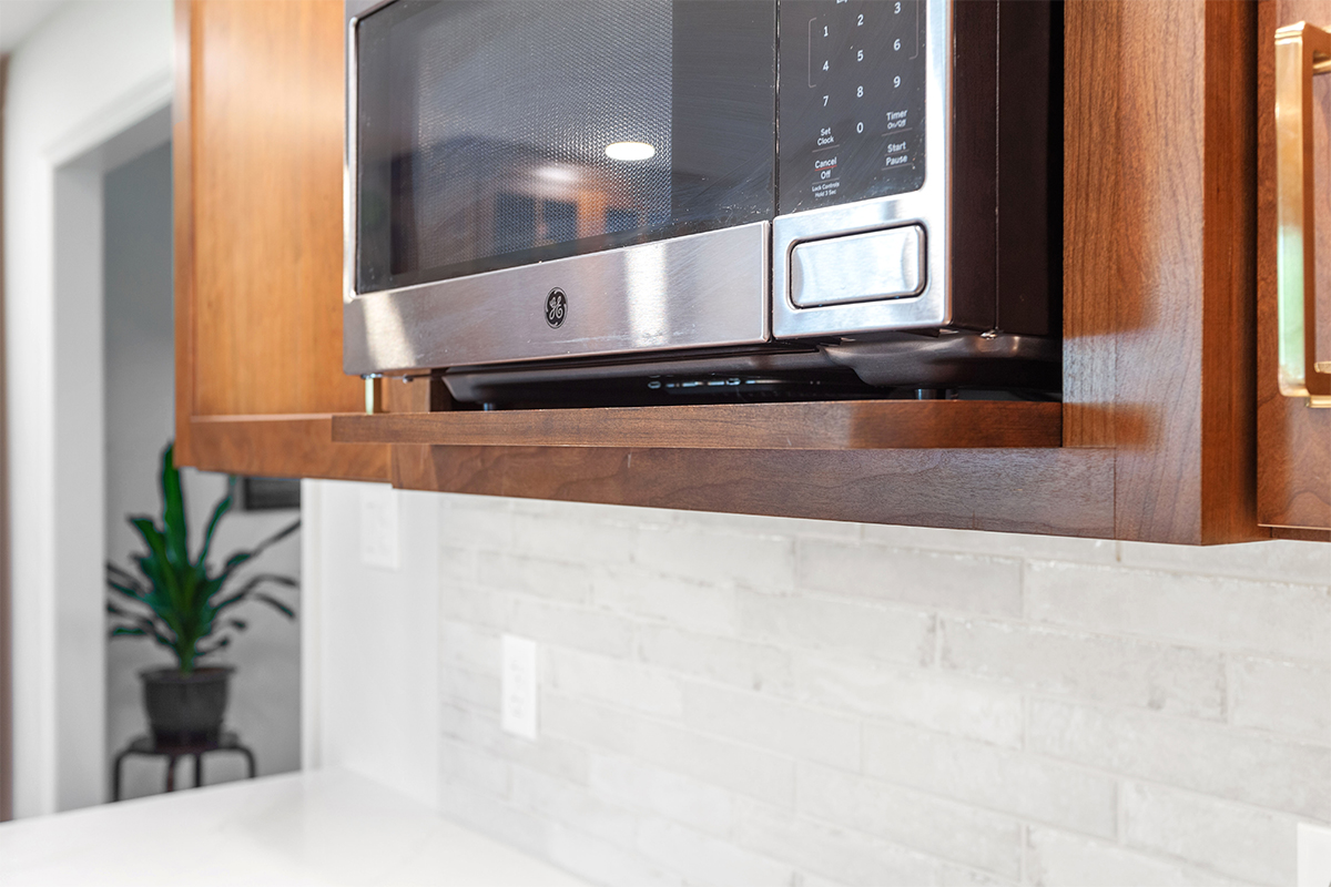 Microwave mounted in a cabinet