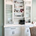 Painted white coffee bar cabinets.