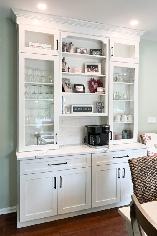 Painted white coffee bar cabinets.