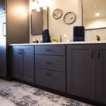 Bathroom with vanity cabinets painted in Hale Navy color.