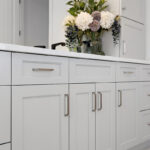 Light gray painted bathroom vanity