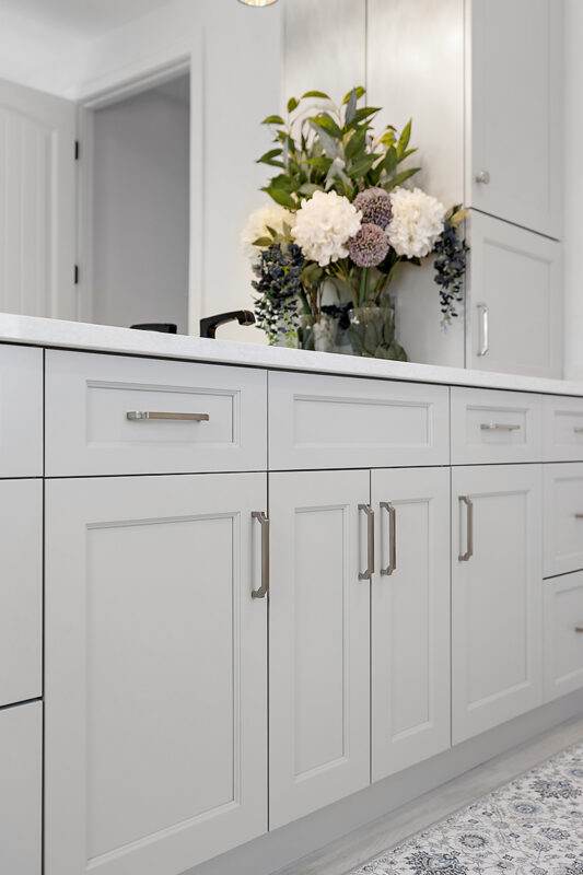 Light gray painted bathroom vanity