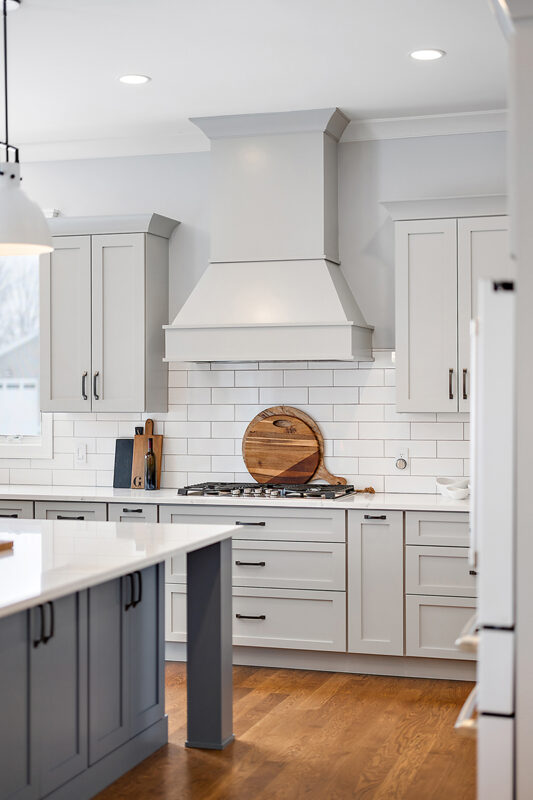 Painted gray kitchen cabinets and island.
