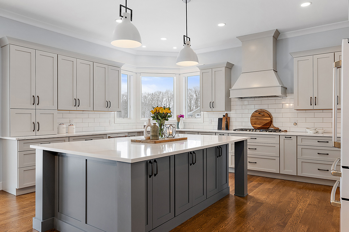 Painted gray kitchen cabinets and island.