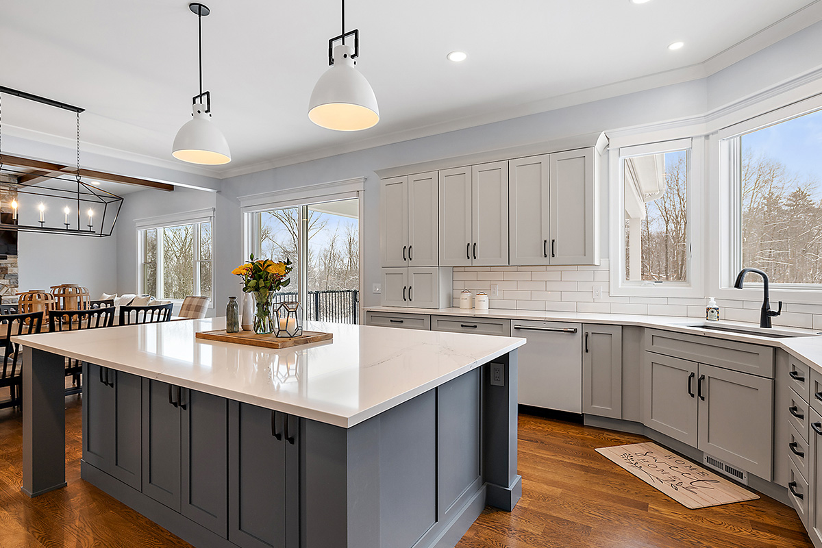Painted gray kitchen cabinets and island.