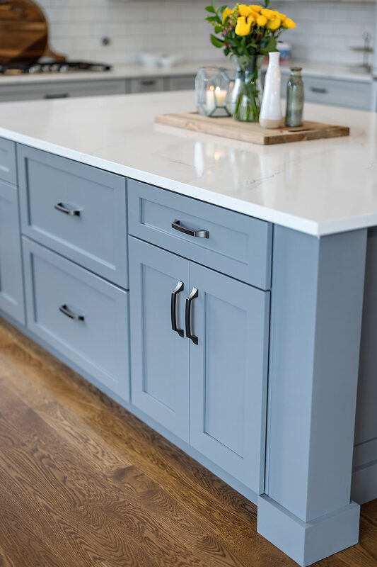 Painted gray kitchen cabinets and island.